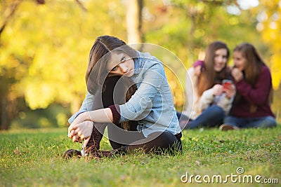 Teens Talking About Girl Stock Photo