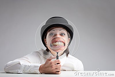 Teeth behind a magnifier and a funny face Stock Photo