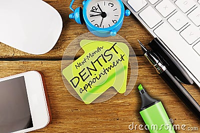 Teeth care concept with reminder on sticky note for dentist appointment Stock Photo