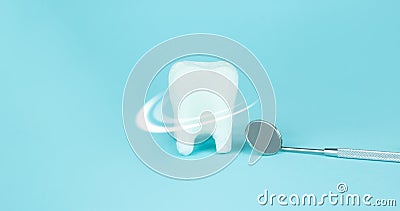 Teeth care and protection concept. Closeup. Whitening of human tooth, white shining tooth and dentist mouth mirror, crystal Stock Photo