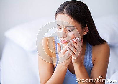 Teeth Problem. Woman Feeling Tooth Pain. Closeup Of A Beautiful Sad Girl Suffering From Strong Tooth Pain. Attractive Stock Photo