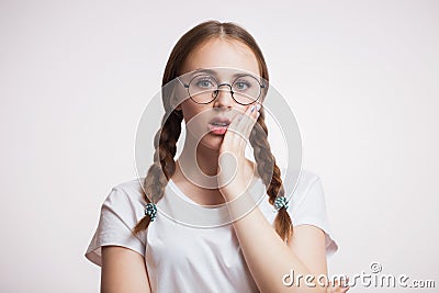 Teeth problem. Woman feeling toothache. Closeup of beautiful sad girl suffering from strong tooth pain. Dental health and care con Stock Photo