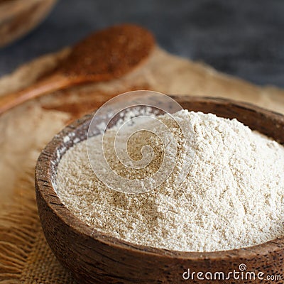 Teff flour in a bowl and teff grain with a spoon Stock Photo