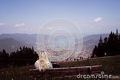 Woman in the mountains enjoying view of lake Tegernsee Editorial Stock Photo