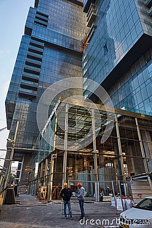 Tel-Aviv - 9 December, 2016: Workers near high-store building si Editorial Stock Photo