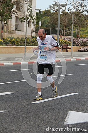 Tel Aviv Gillette Marathon. Overcoming the pain Editorial Stock Photo
