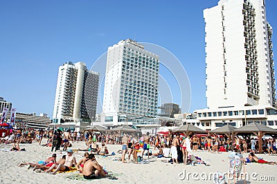 Tel Aviv, Israel - June 7, 2013: Beach of Tel Aviv with beautiful hotels and lots of holidaymakers. Israel. Editorial Stock Photo