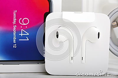 TEL AVIV, ISRAEL - NOVEMBER 23, 2017: Iphone X smart phone with charger and earphone. Latest Apple Iphone 10 mobile phone. Editorial Stock Photo