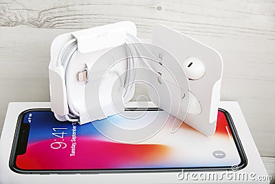 TEL AVIV, ISRAEL - NOVEMBER 23, 2017: Iphone X smart phone with earphone. Latest Apple Iphone 10 mobile phone. Editorial Stock Photo