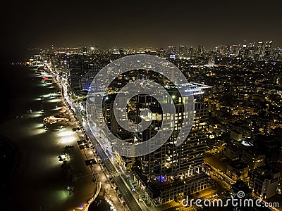 Tel-Aviv night panoramic view. Night lights of populous Israeli city at Mediterranean Sea shore. Cityscape of Tel Aviv at night. Stock Photo