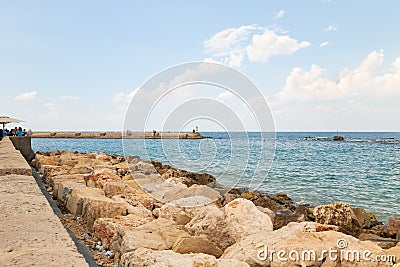 Promenade in the old town of Yafo and the skyscrapers of Tel Aviv in the distance, in Tel Aviv - Yafo city, Israel Editorial Stock Photo