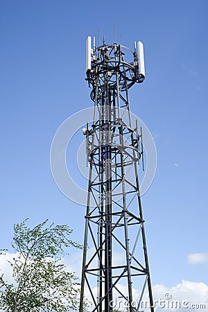 Telecomms transmitter mast for mobile phone businsses to transmit data and calls across networks Stock Photo