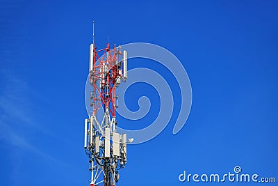 Telecommunication pylon with signal repeaters and antennas against blue sky for wireless technology and broadcasting industry Stock Photo