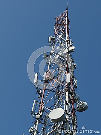 Telecommunication tower with blue skyline Stock Photo