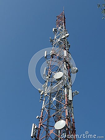 Telecommunication tower with blue skyline Stock Photo