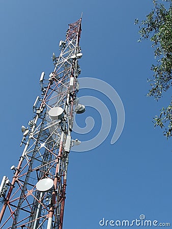 Telecommunication tower with blue skyline Stock Photo