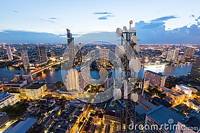 Telecommunication tower with 5G cellular network antenna on city background Editorial Stock Photo