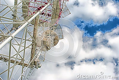 Telecommunication tower with a sunlight. Used to transmit television signals. Stock Photo