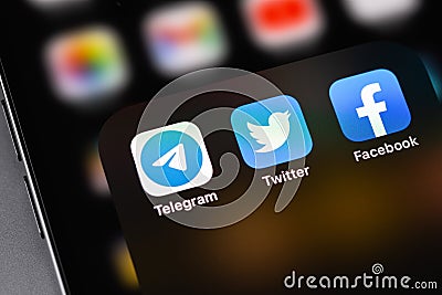 Telegram, Twitter, Facebook - social media mobile messengers icons apps on screen smartphone iPhone closeup macro Editorial Stock Photo