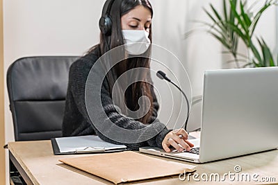 Telemarketer woman working on laptop Stock Photo