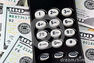 Telephone keypad and cash money. Stock Photo