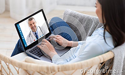 Telemedicine concept. Young lady consulting her doctor on laptop computer, using webcam from home, panorama Stock Photo