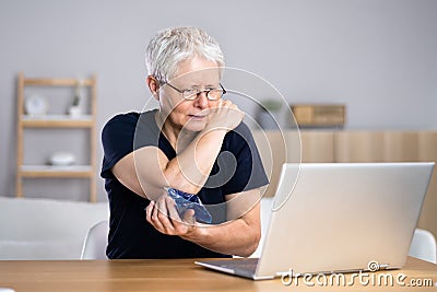 Telemedicine Ehealth Conference With Physician. Elbow Pain Stock Photo