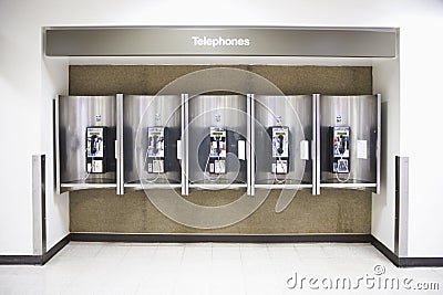 Telephones in an airport Stock Photo