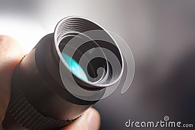 Telescope eyepiece with rubber eyecup, hand hold Stock Photo