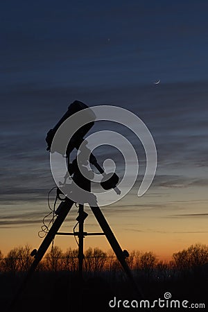 Telescope at sunset Stock Photo