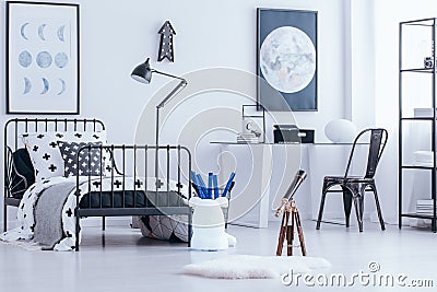 Telescope in teenager`s bedroom Stock Photo