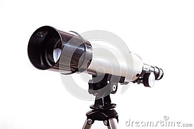 Telescope on a white background laid on wooden board Stock Photo