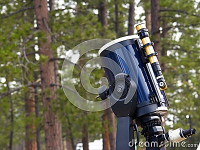 Telescope in the woods Stock Photo