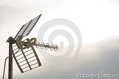 television antennas with sky background. Analog television antenna on roof. Stock Photo