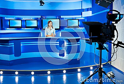 Television newscaster at blue TV studio Stock Photo