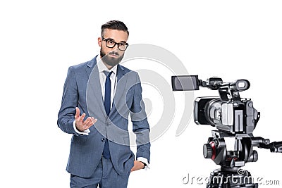 television reporter gesturing and standing in front of camera, Stock Photo