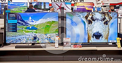 Televisions of different brands in the electronics store. Minsk, Belarus - March 2021 Editorial Stock Photo