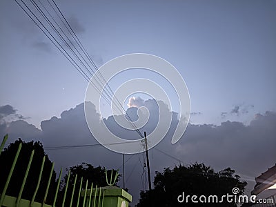 Telkom pole and twilight next to the mosque Stock Photo