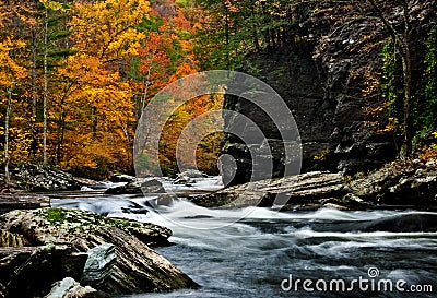 Tellico River autumn colors with blurred rushing water. Stock Photo