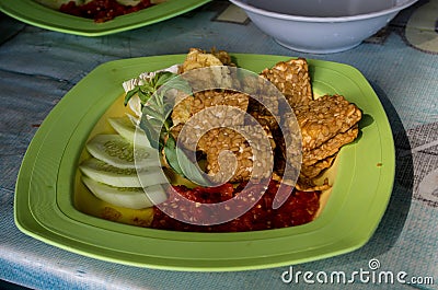 Tempeh Penyet typical Indonesian dish at local restaurant Stock Photo