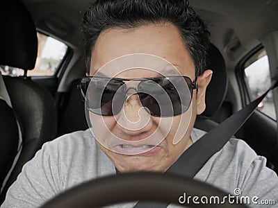 Temperamental Driver Concept, Angry Man Speeding Dangerously Stock Photo