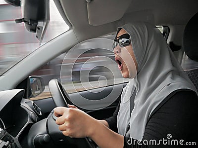 Temperamental Driver Concept, Angry Woman in Traffic Jam Stock Photo