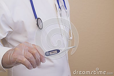 Physcian or nurse holding a thermometer with a high temprature reading . Stock Photo