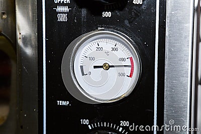 Temperature sensor on an industrial dirty black metal oven Stock Photo