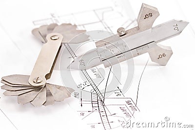 Templates for visual measurement control are on the drawing pipe Stock Photo