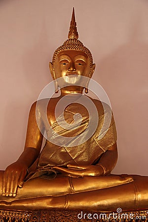 One Gold Buddhas With Mercifulness Face Seat On Stucco Base Stock Photo