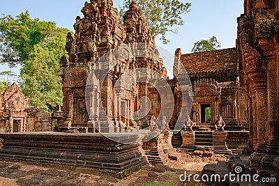 Temple Banteay Srei, Cambodia. Ruins of Hindu Temple Banteay Srei near Angkor Wat. Monkey guards in front of temple entrance Stock Photo