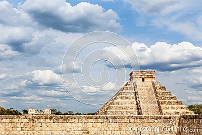 Temple of Kukulcan or the Castle and stone wall in foreground, the center of the Chichen Itza maya archaeological site, Yucatan, Stock Photo