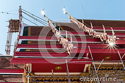 Temple roof vintage Thai style with against blue sky background Editorial Stock Photo