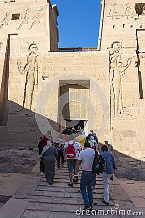 Tourists entering the Altar of Phiale Temple - Egypt Editorial Stock Photo